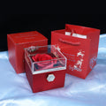 Red rotating rose gift box with gift bag